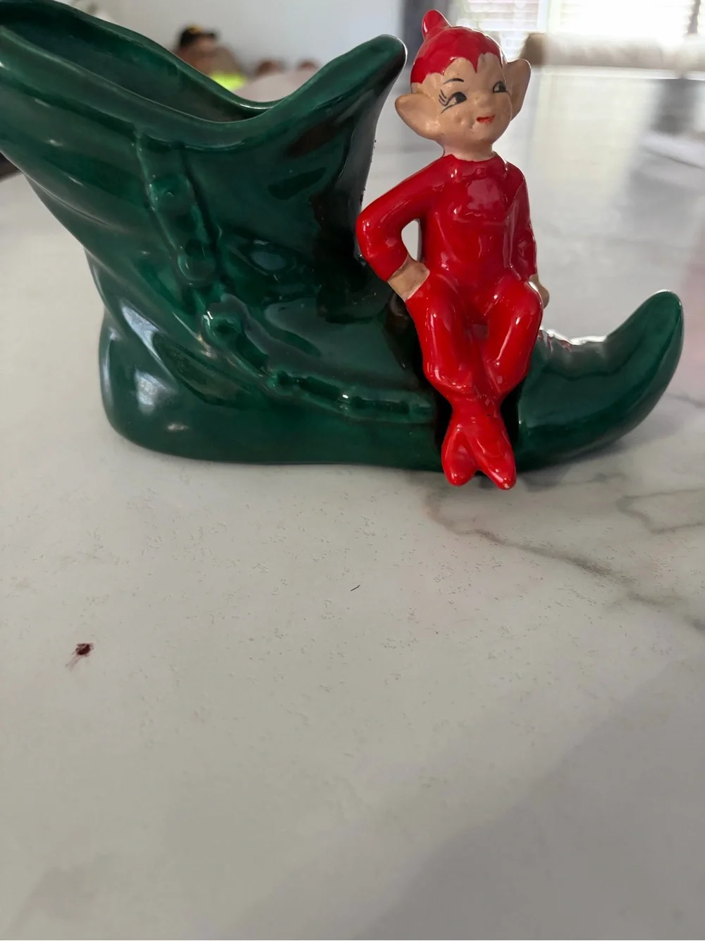 Vintage mid century ceramic pixie elf on a green boot 1950s